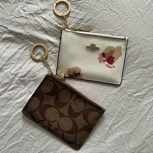 Two never used Coach keychain card purse